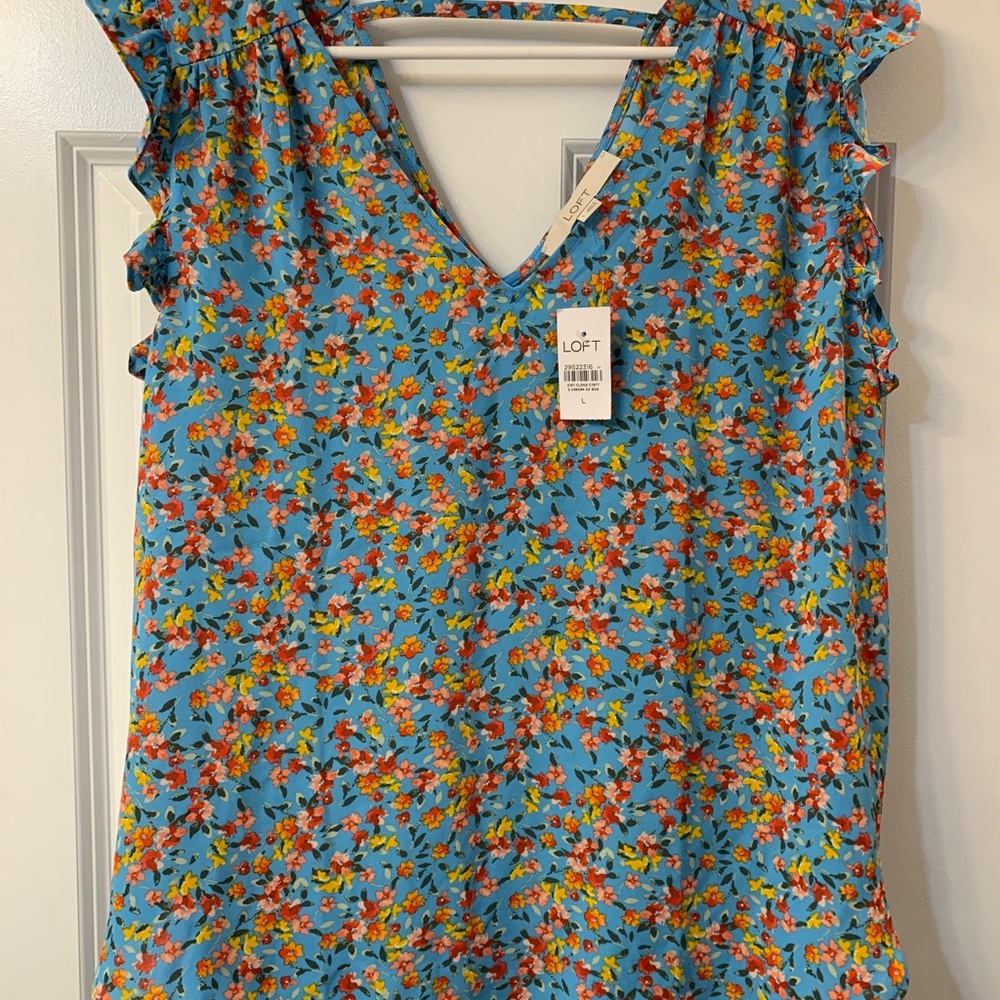 Floral bar back flutter shell. NWT.